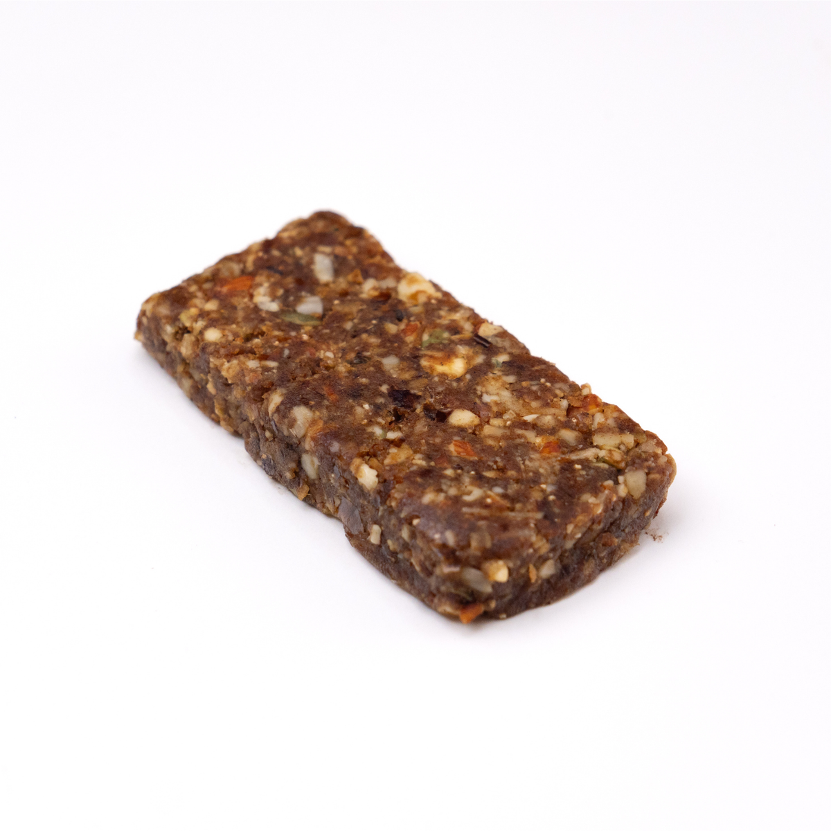 A single rectangular protein bar with visible dates, nuts, seeds, and dried fruit pieces, photographed on a clean white background.